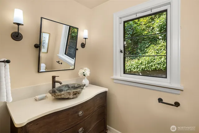 a spacious bedroom with a bed and a window