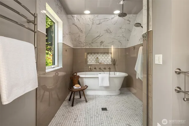 a bathroom with a granite countertop sink mirror and a window