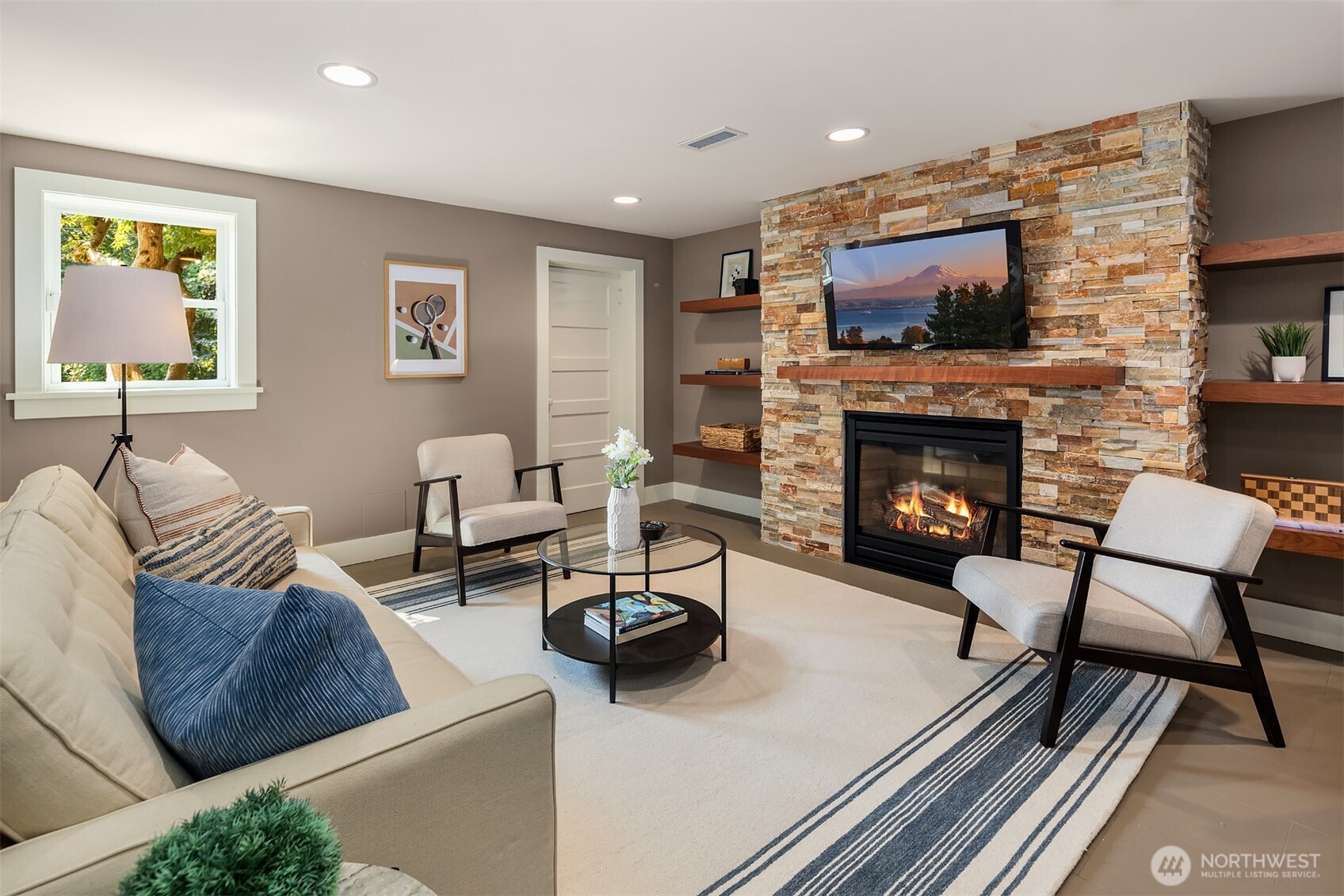 3322 East Terrace Street Seattle, WA 98122 - Photo 20 of 39 a living room with furniture and a fireplace