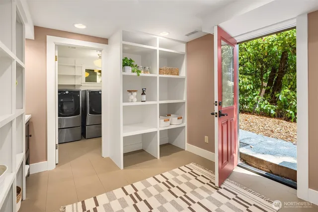 a view of a yard with plants and trees