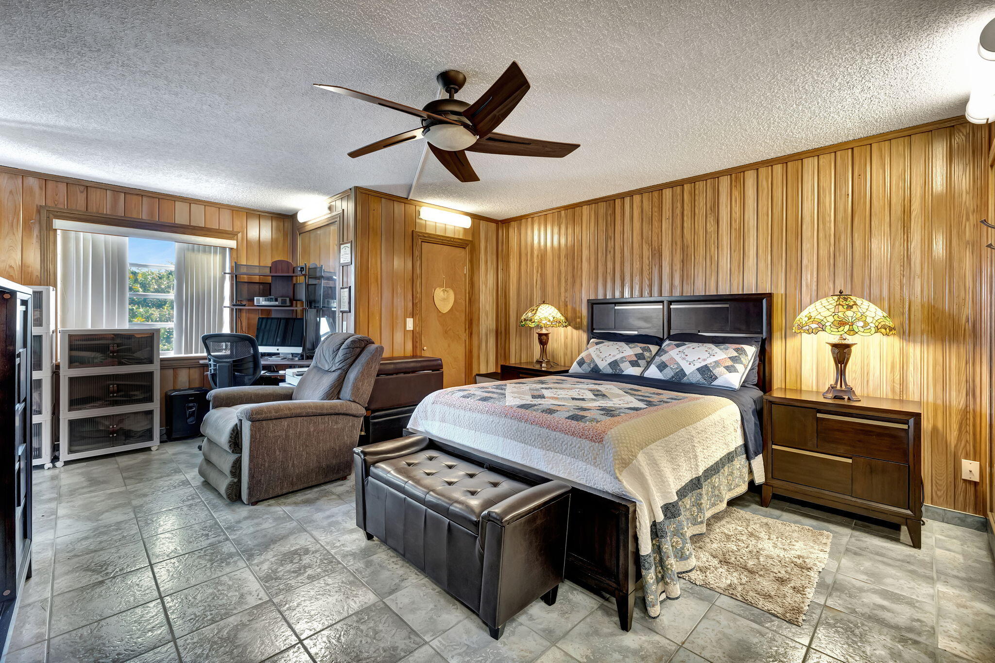 3910 Inverrary Boulevard, Unit 601B Lauderhill, FL 33319 - Photo 19 of 56 a bedroom with a bed and wooden floor