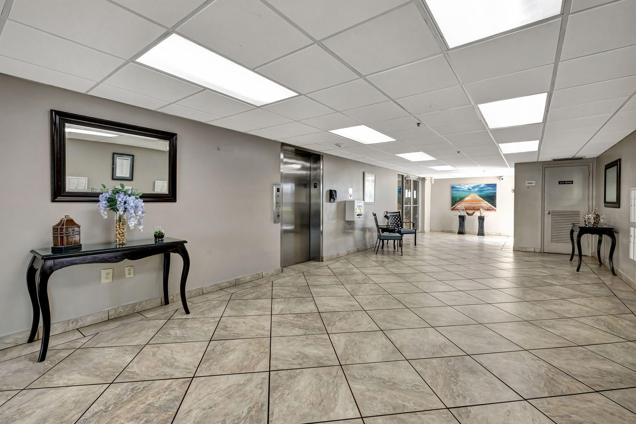 3910 Inverrary Boulevard, Unit 601B Lauderhill, FL 33319 - Photo 27 of 56 a lobby with furniture and a potted plant