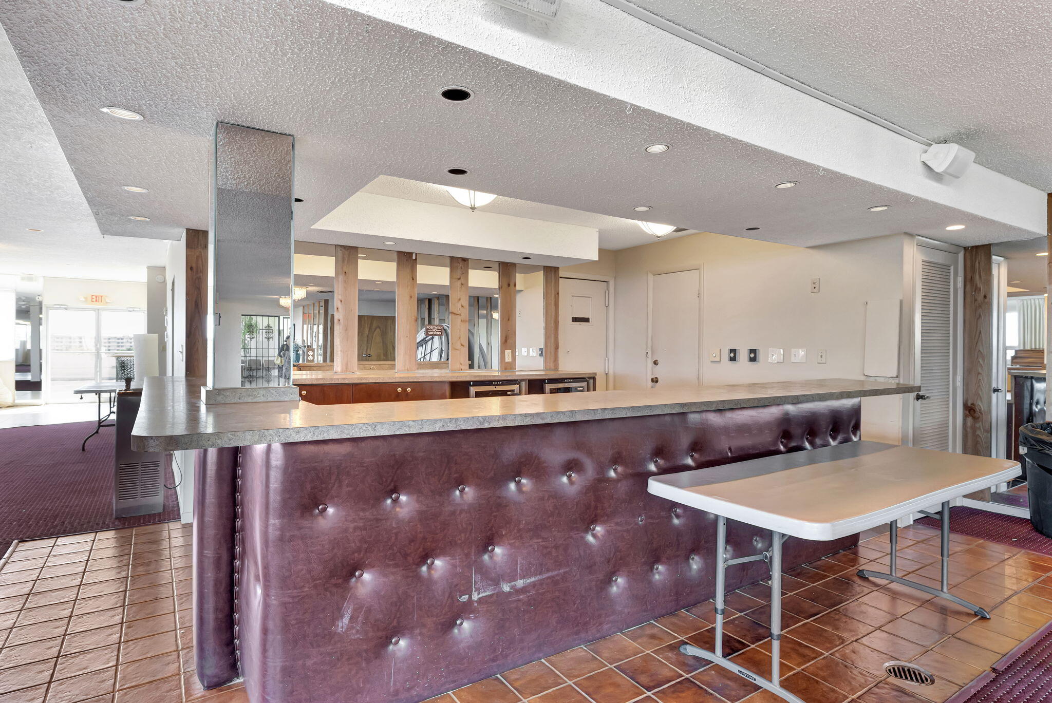 3910 Inverrary Boulevard, Unit 601B Lauderhill, FL 33319 - Photo 48 of 56 a living room with furniture and a table