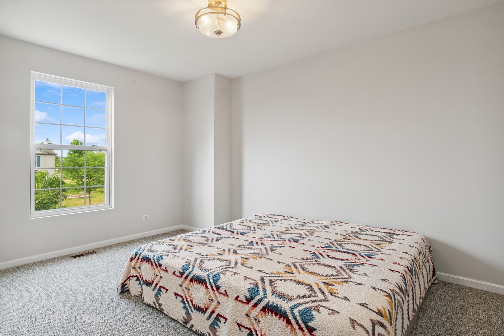 11751 Glenn Circle Plainfield, IL 60585 - Photo 14 of 19 a bedroom with a bed and window