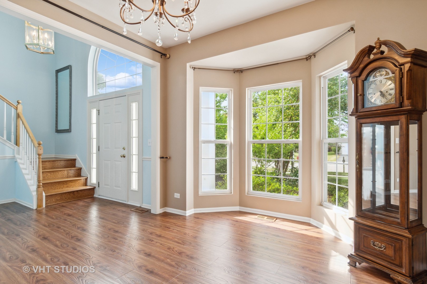 11751 Glenn Circle Plainfield, IL 60585 - Photo 8 of 19 a view of an entryway with wooden floor and door