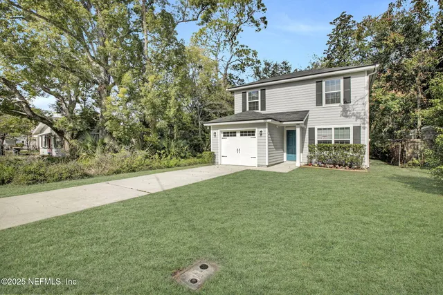 a backyard of a house with lots of green space