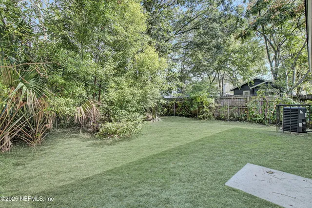 a backyard of a house with lots of green space
