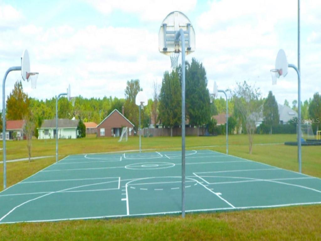 Caesar Avenue Orlando, FL 32833 - Photo 11 of 12 a view of a swimming pool with an outdoor space and seating area