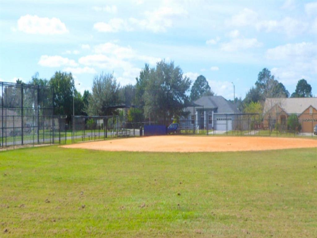 Caesar Avenue Orlando, FL 32833 - Photo 5 of 12 a view of a outdoor space with swimming pool in the background