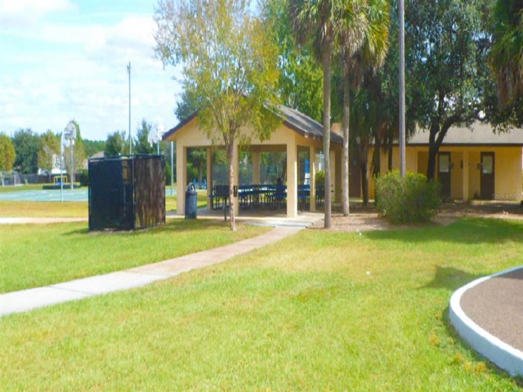 Caesar Avenue Orlando, FL 32833 - Photo 9 of 12 a view of a house with a swimming pool