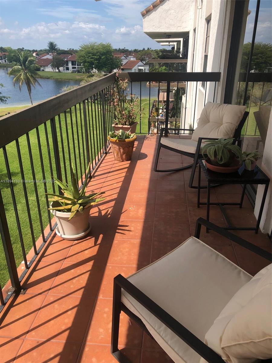 1350 Southwest 122nd Avenue, Unit 423 Miami, FL 33184 - Photo 6 of 8 a view of balcony with furniture