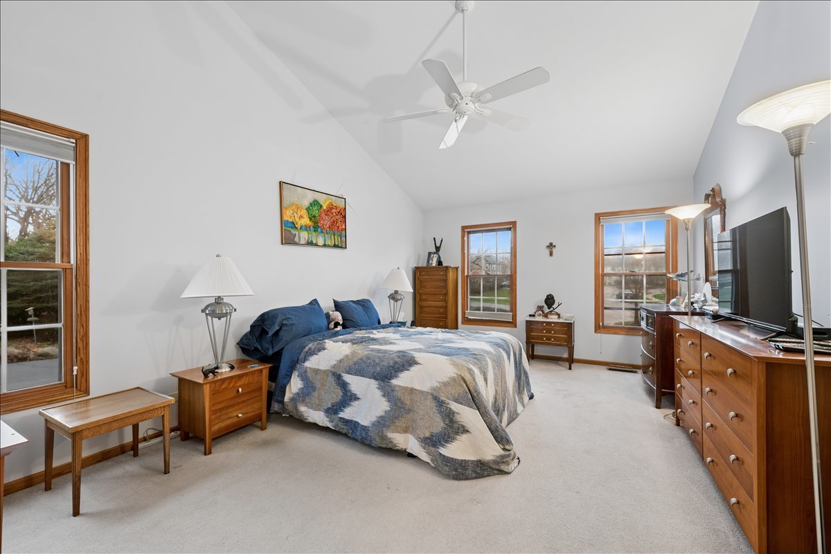 602 Birch Lane Fox River Grove, IL 60021 - Photo 17 of 37 a bedroom with bed and a flat tv screen on dresser