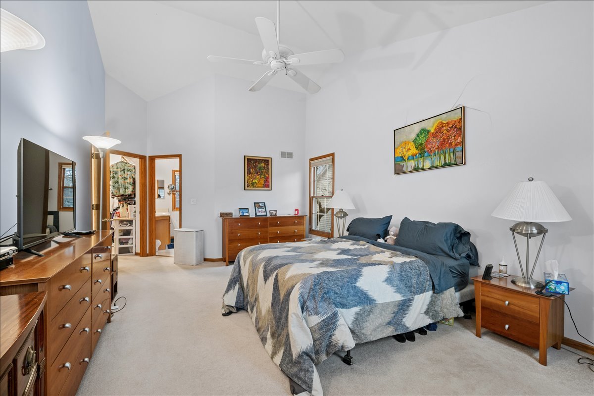 602 Birch Lane Fox River Grove, IL 60021 - Photo 19 of 37 a bedroom with bed and a chandelier