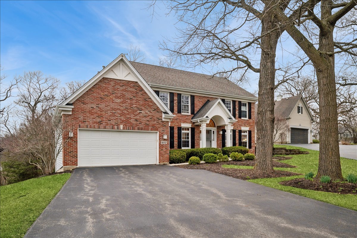 602 Birch Lane Fox River Grove, IL 60021 - Photo 36 of 37 a front view of a house with a garden and garage