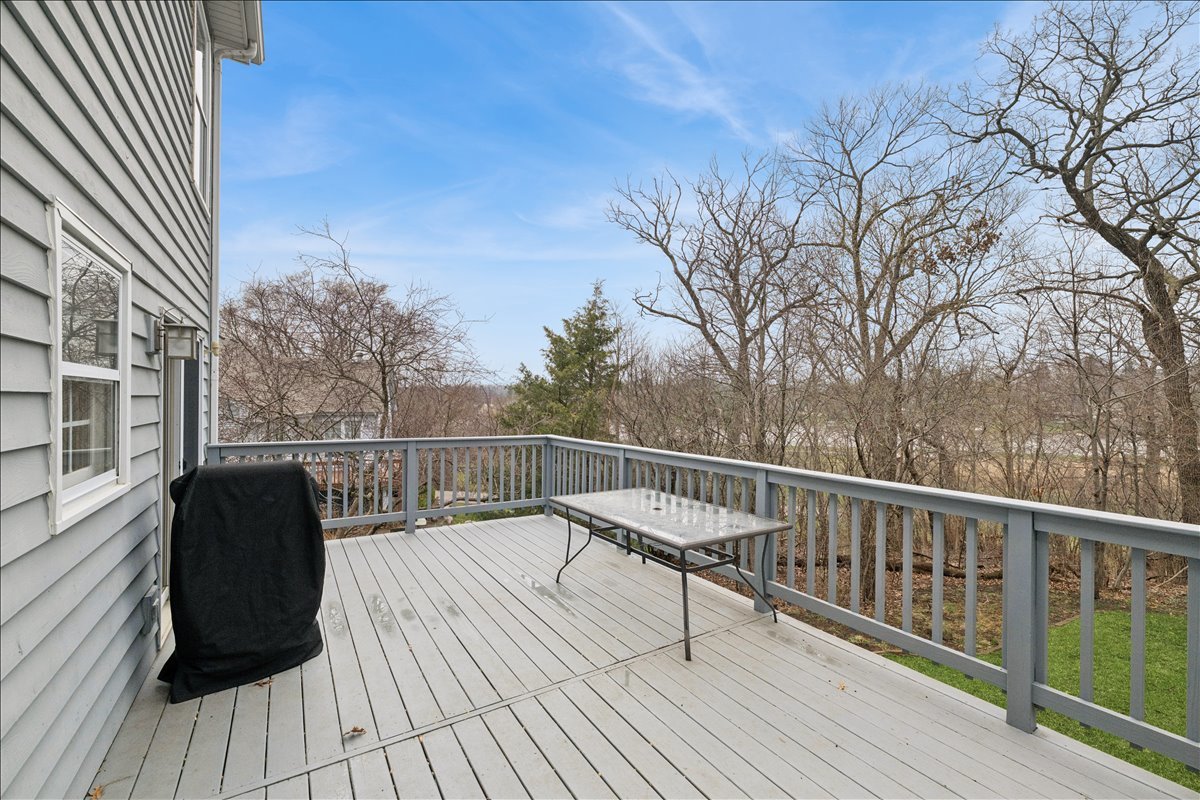602 Birch Lane Fox River Grove, IL 60021 - Photo 6 of 37 a view of balcony with wooden floor and fence