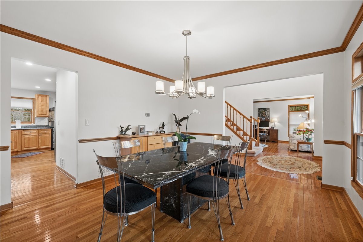 602 Birch Lane Fox River Grove, IL 60021 - Photo 9 of 37 a view of a dining room with furniture and wooden floor