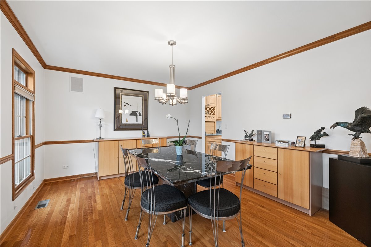 602 Birch Lane Fox River Grove, IL 60021 - Photo 10 of 37 a view of a dining room with furniture window and wooden floor