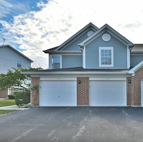 a front view of a house with a garage