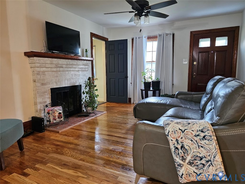 3200 Manorcrest Road Richmond, VA 23234 - Photo 2 of 23 Hardwood flooring, brick fireplace with wood mante