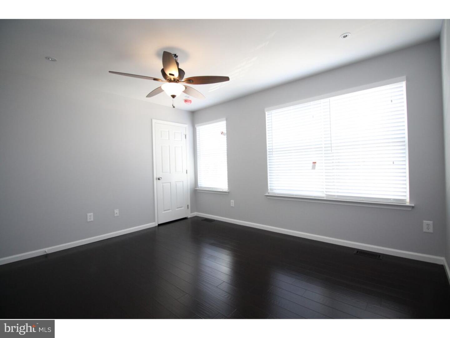 13 Millstream Road Pine Hill, NJ 08021 - Photo 11 of 22 a view of an empty room with wooden floor and a window