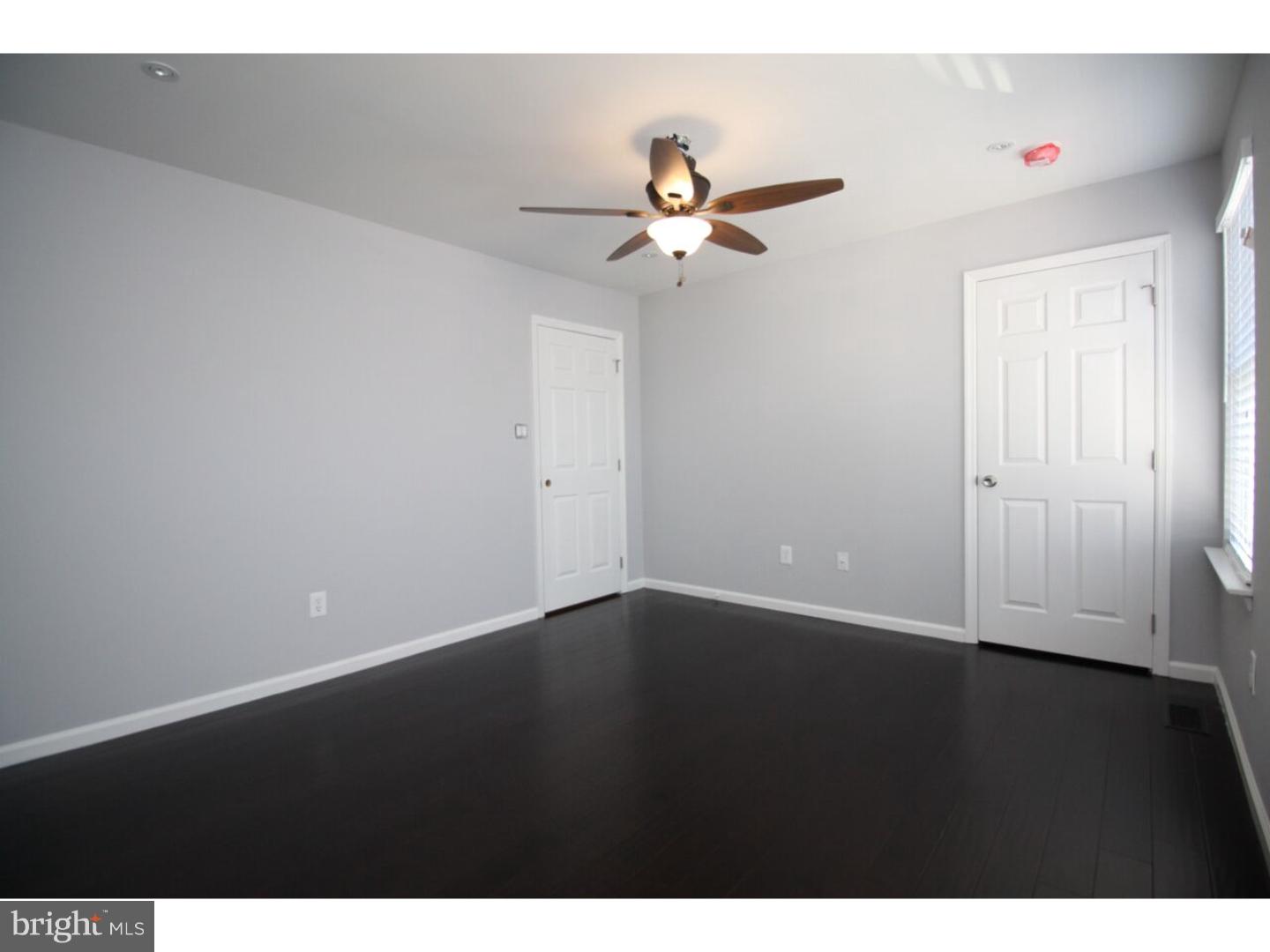 13 Millstream Road Pine Hill, NJ 08021 - Photo 12 of 22 a view of an empty room with a ceiling fan and wooden floor