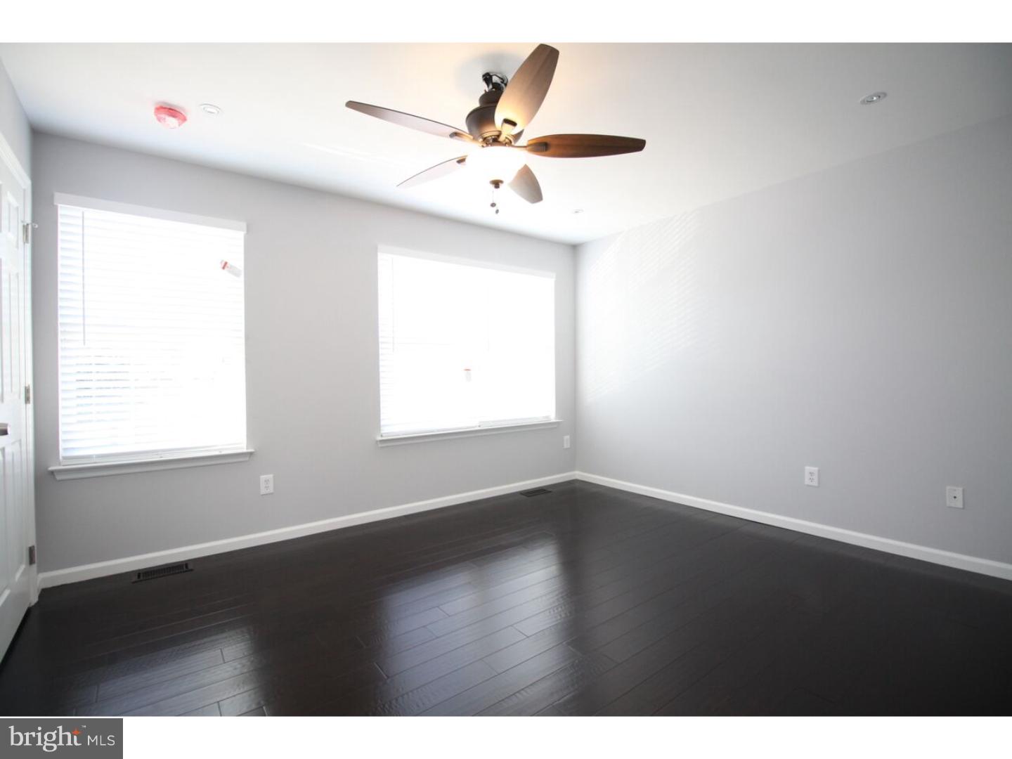 13 Millstream Road Pine Hill, NJ 08021 - Photo 13 of 22 a view of an empty room with wooden floor and a window