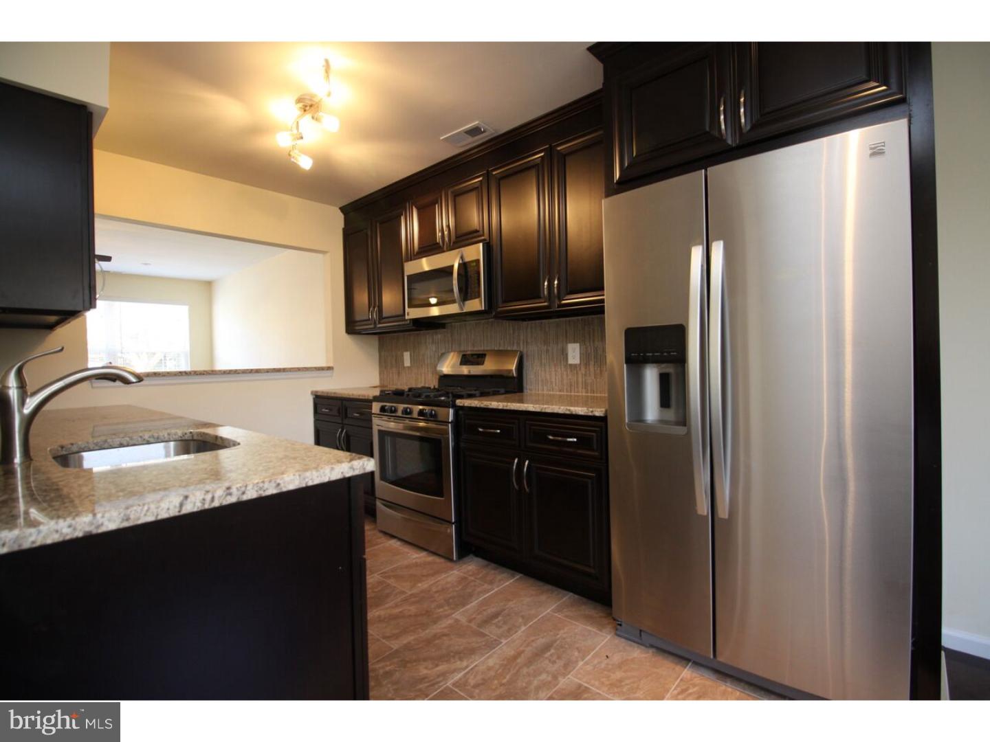 13 Millstream Road Pine Hill, NJ 08021 - Photo 6 of 22 a kitchen with granite countertop stainless steel appliances and refrigerator