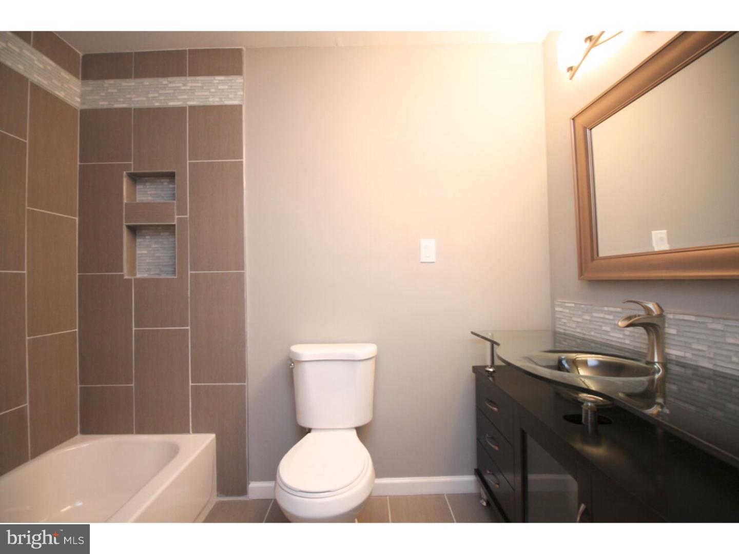 13 Millstream Road Pine Hill, NJ 08021 - Photo 8 of 22 a bathroom with a toilet a sink and mirror
