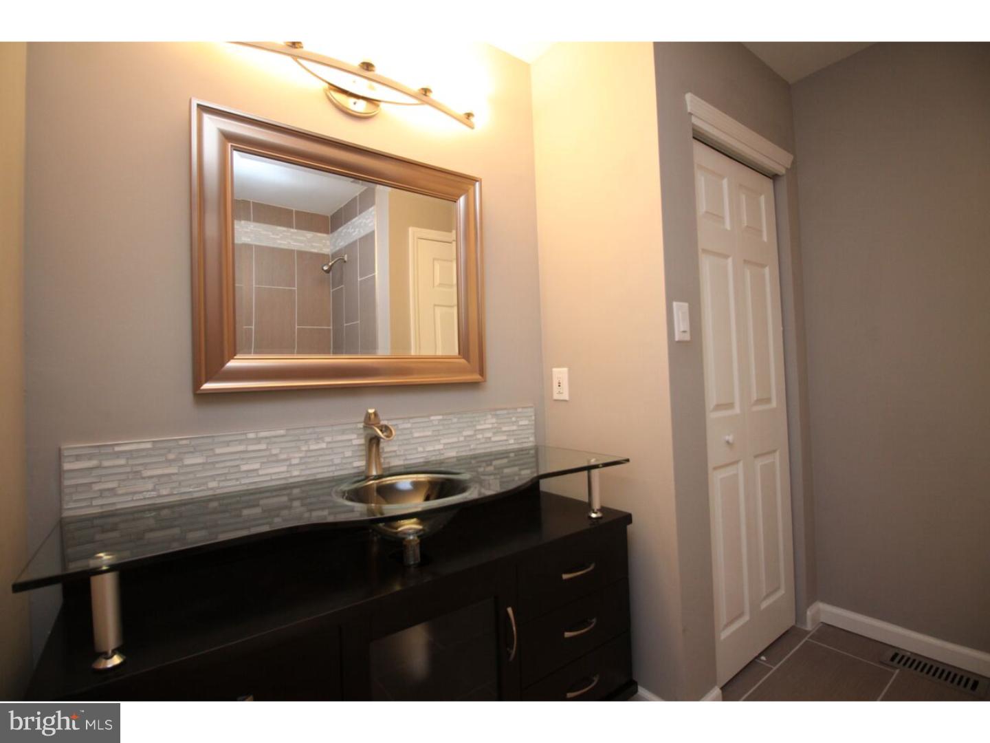 13 Millstream Road Pine Hill, NJ 08021 - Photo 9 of 22 a bathroom with a sink a vanity and a mirror