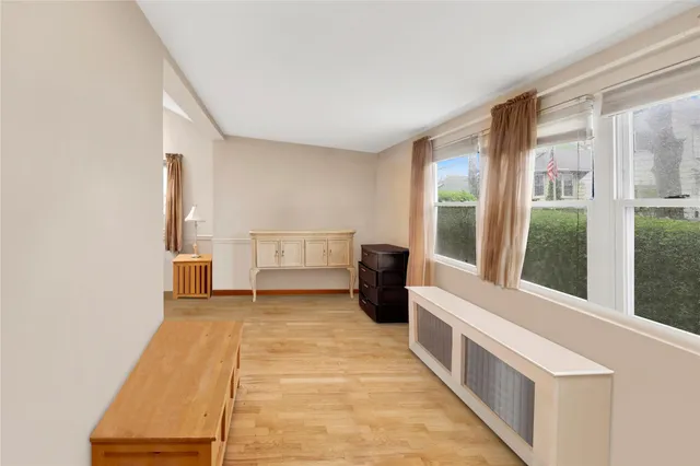 a view of a room with a window and a kitchen