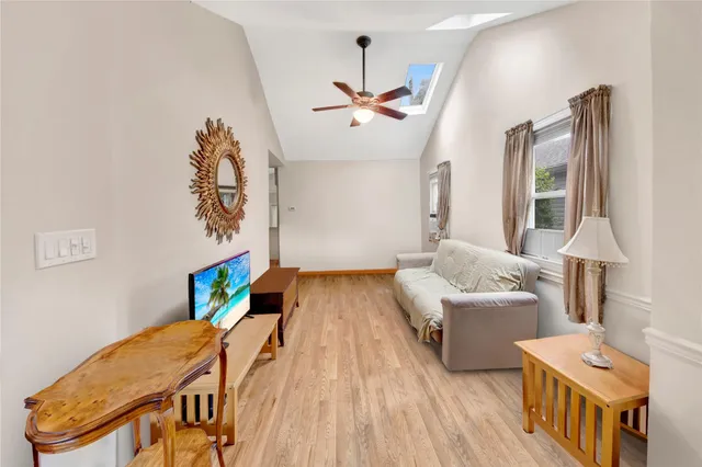 a bedroom with furniture and a wooden floor
