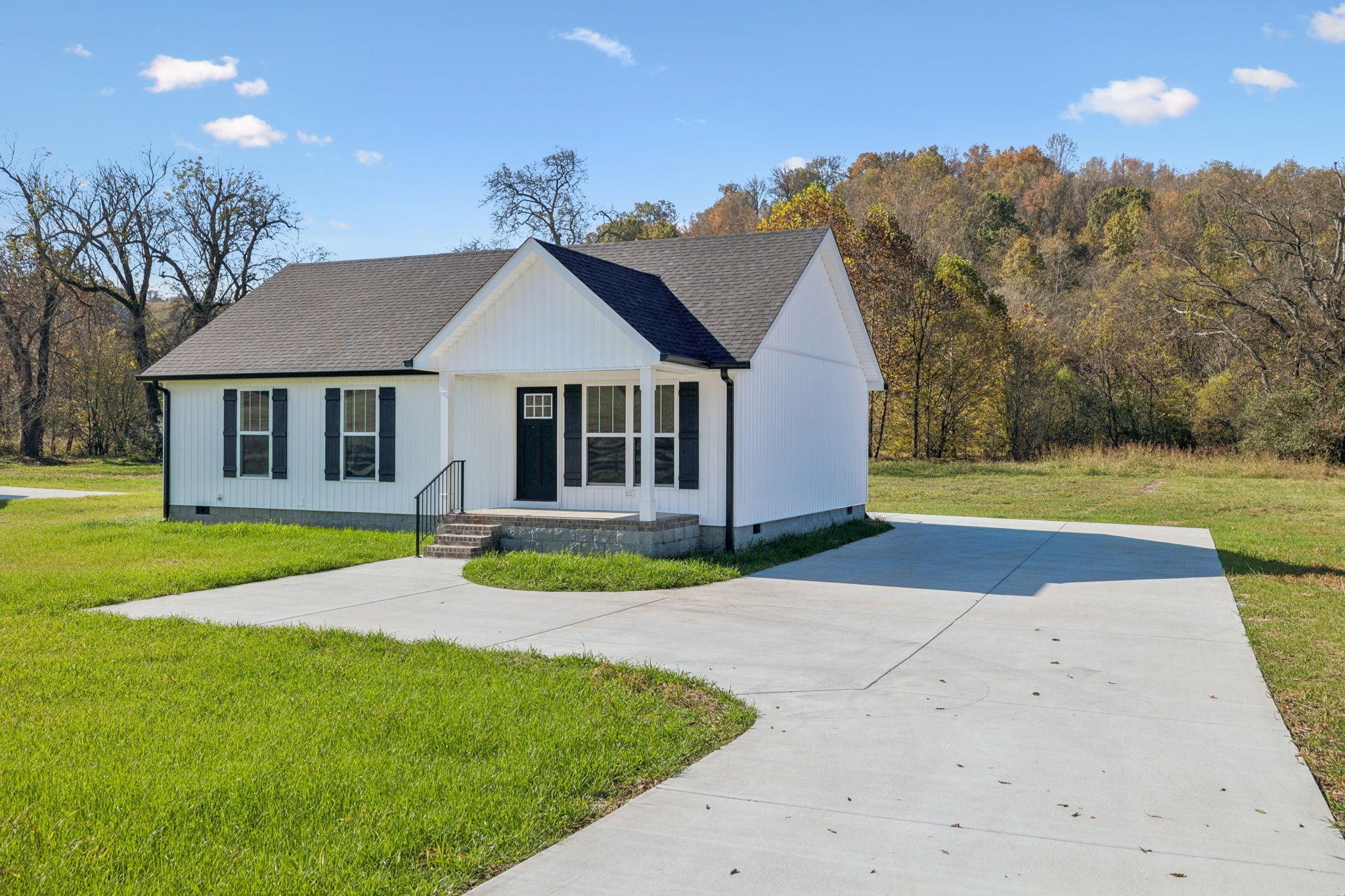 1578 Big Dry Creek Road Pulaski, TN 38478 - Photo 2 of 45 a house with garden in the background