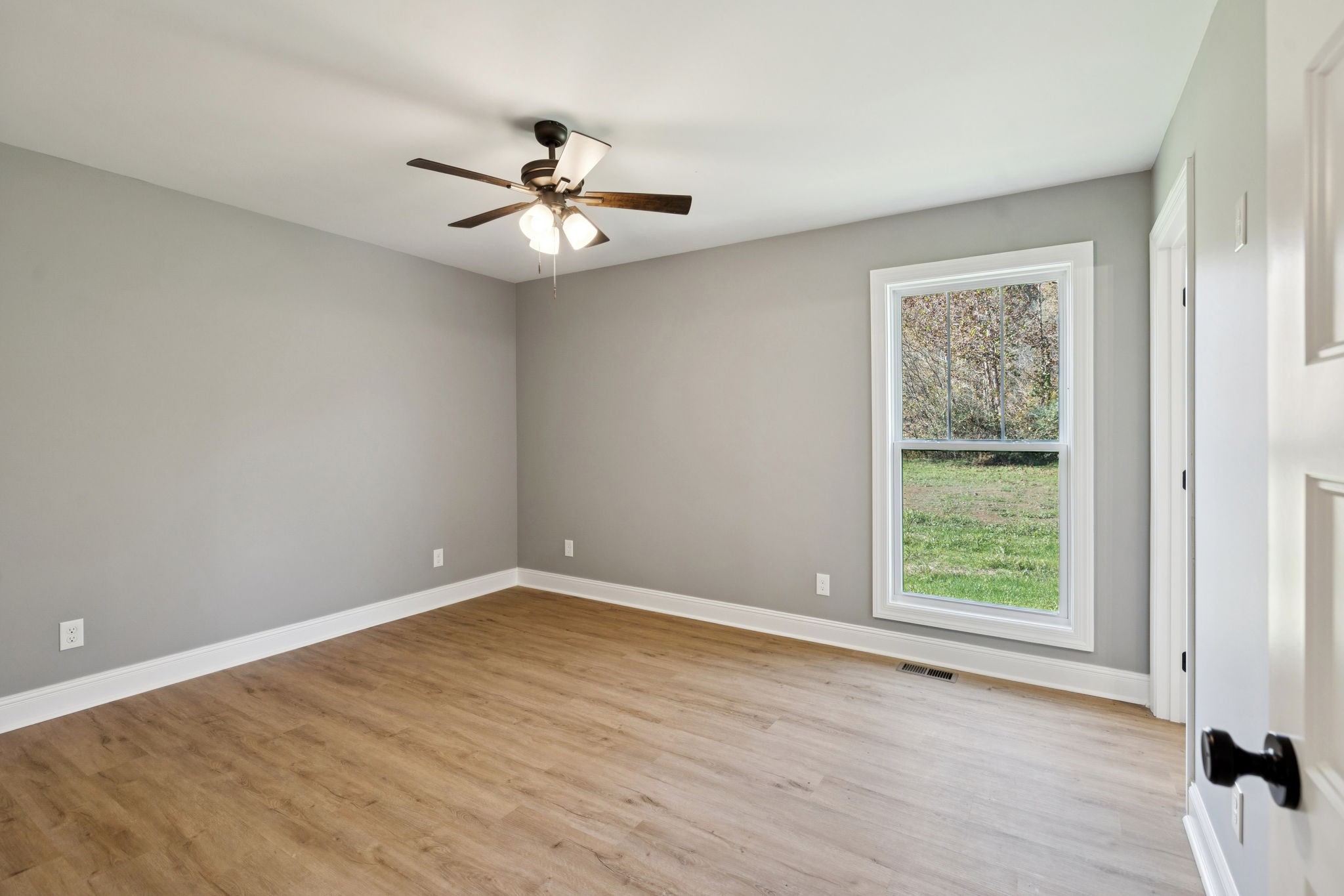 1578 Big Dry Creek Road Pulaski, TN 38478 - Photo 30 of 45 an empty room with a window and a fan