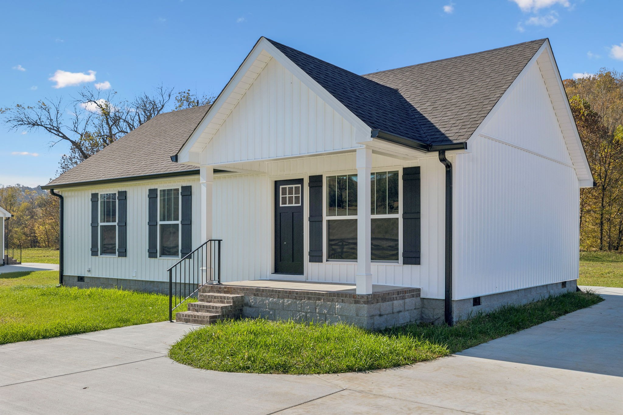 1578 Big Dry Creek Road Pulaski, TN 38478 - Photo 3 of 45 a front view of a house with a yard and porch