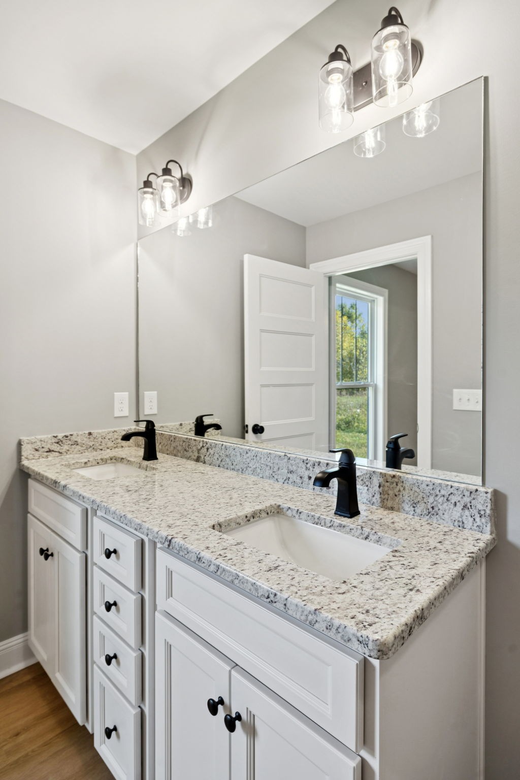 1578 Big Dry Creek Road Pulaski, TN 38478 - Photo 33 of 45 a bathroom with a granite countertop sink and a mirror
