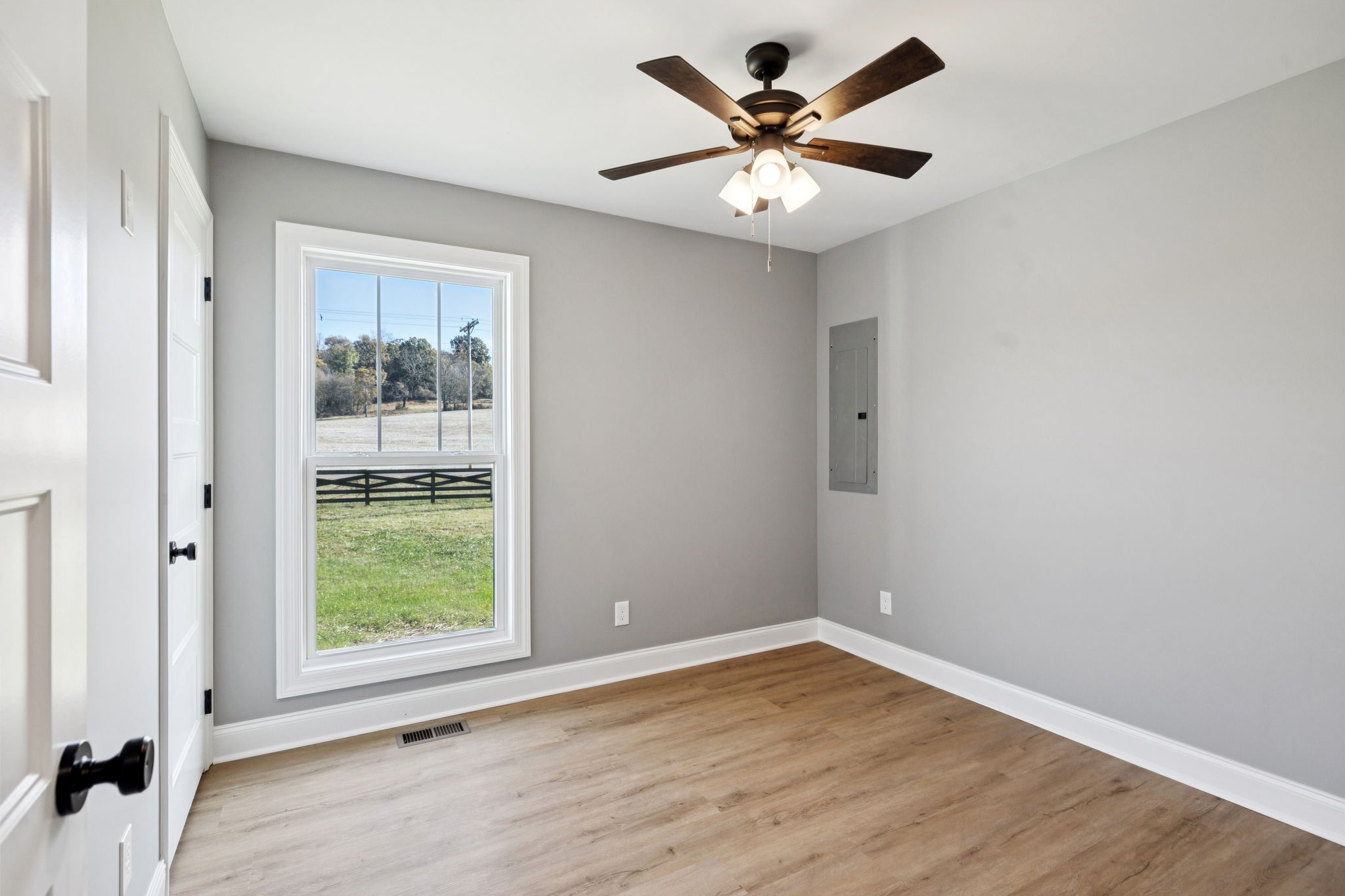1578 Big Dry Creek Road Pulaski, TN 38478 - Photo 35 of 45 an empty room with a window and a ceiling fan