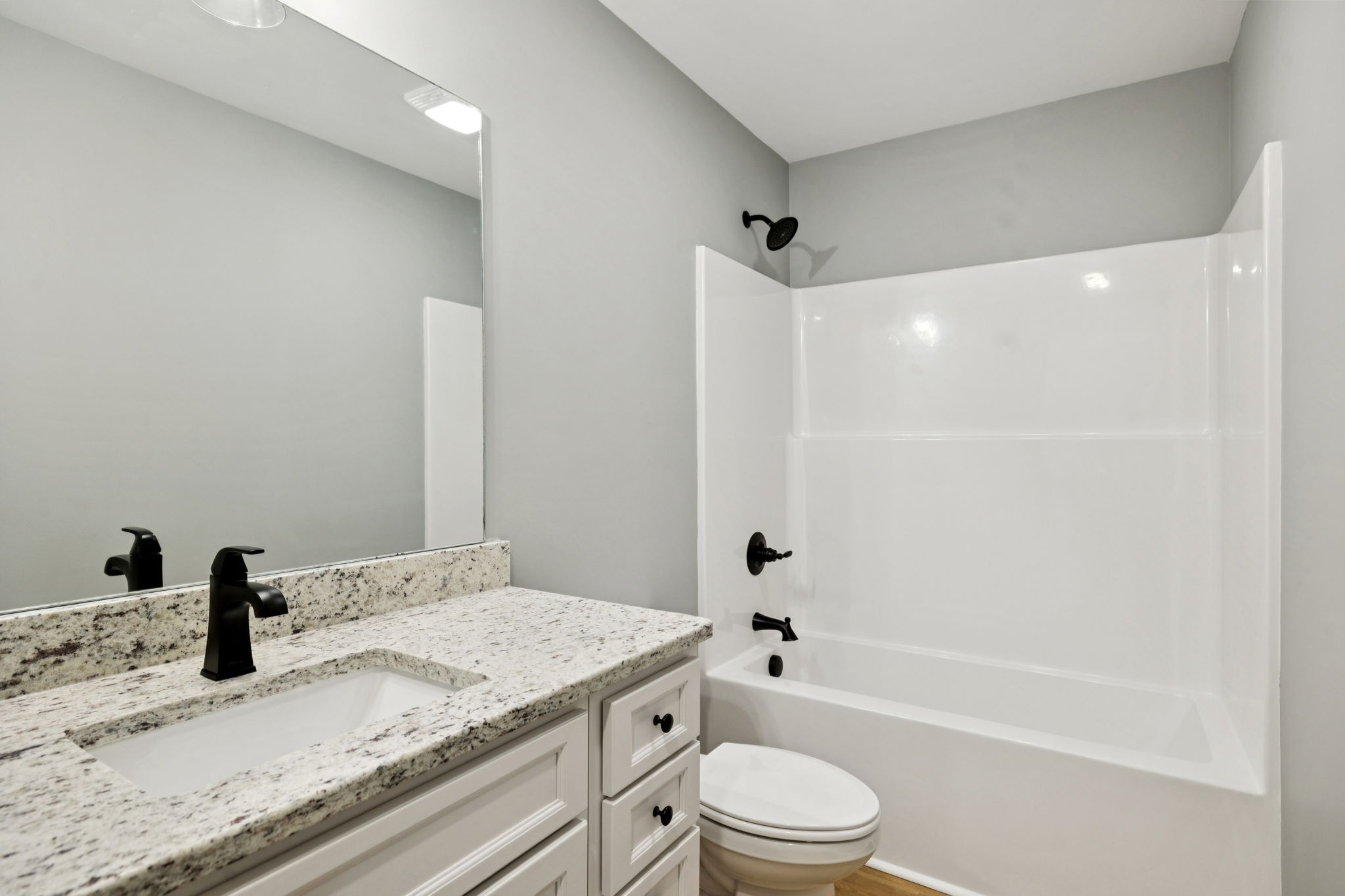 1578 Big Dry Creek Road Pulaski, TN 38478 - Photo 39 of 45 a bathroom with a granite countertop bathtub shower sink vanity and toilet