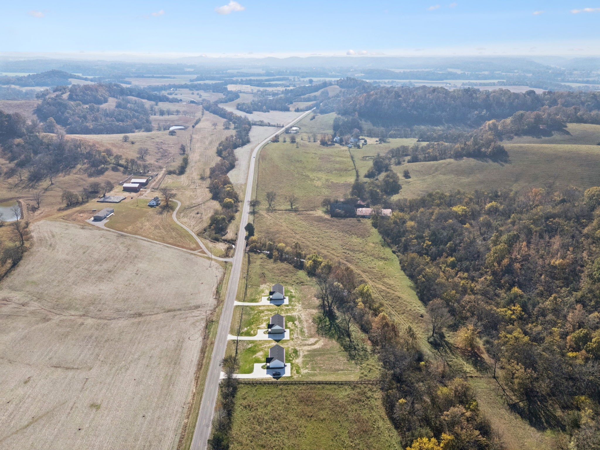 1578 Big Dry Creek Road Pulaski, TN 38478 - Photo 44 of 45 an aerial view of a house with a mountain