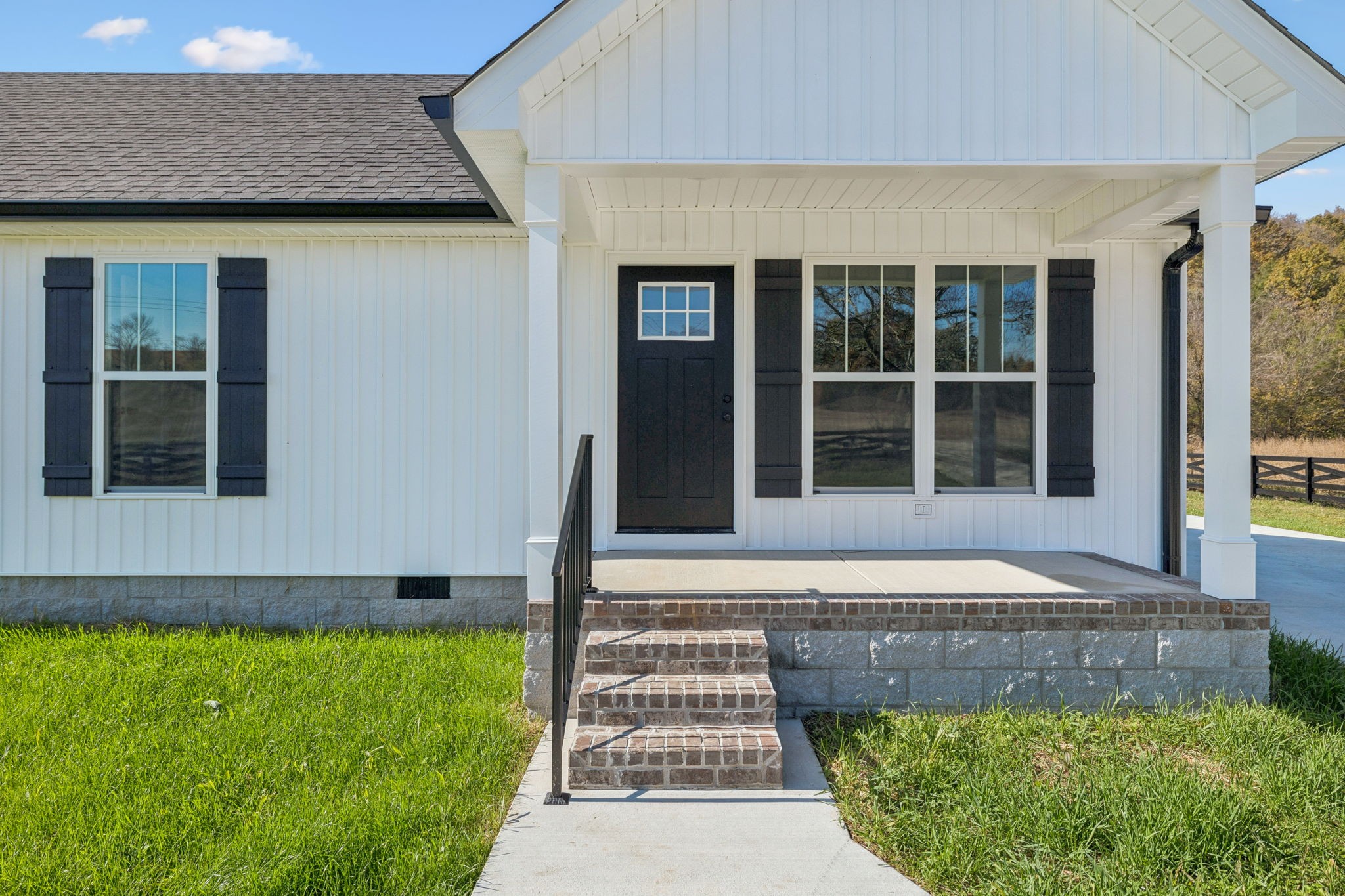1578 Big Dry Creek Road Pulaski, TN 38478 - Photo 5 of 45 a front view of a house with a garden