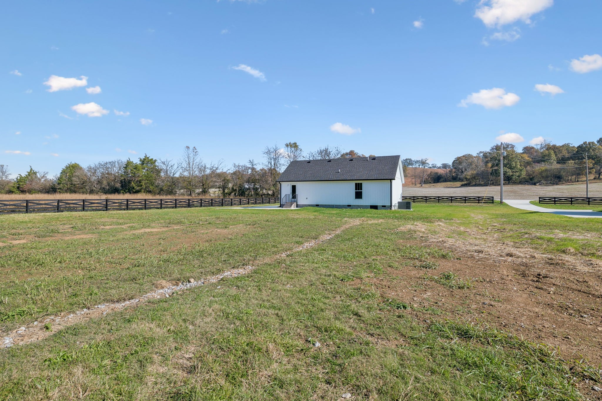 1578 Big Dry Creek Road Pulaski, TN 38478 - Photo 9 of 45 a view of a house with a yard and a large tree