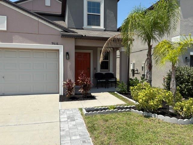 9616 Lemon Drop Loop Sun City Center, FL 33573 - Photo 3 of 53 a view of a house with potted plants