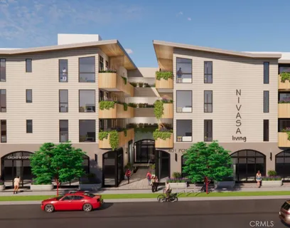 a front view of building with cars parked
