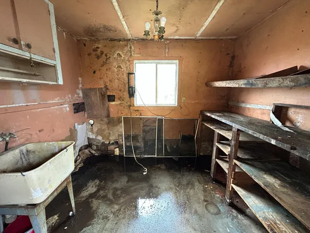 a room with a chair and a stove