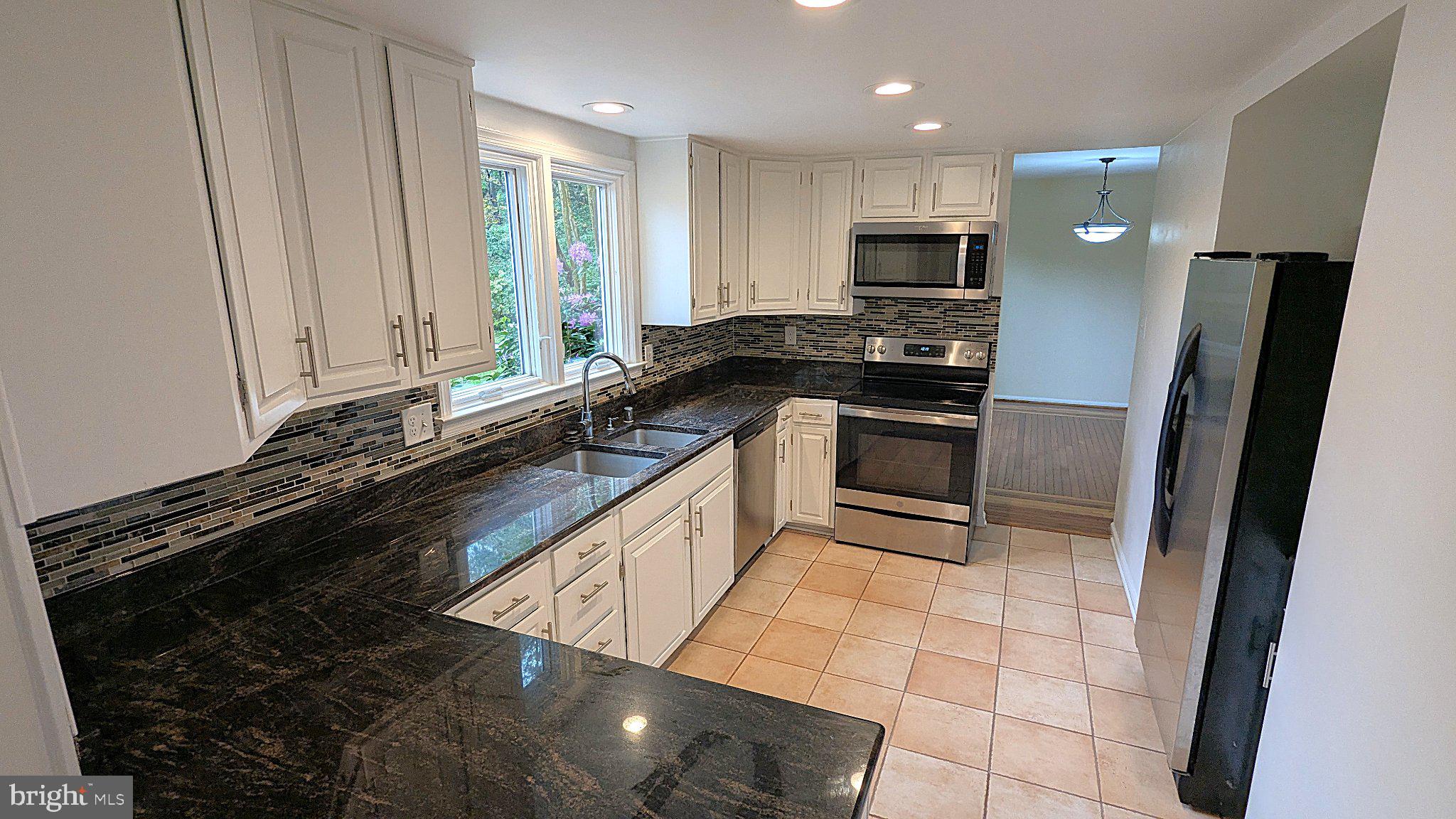 1835 Batten Hollow Road Vienna, VA 22182 - Photo 9 of 50 Modern kitchen with sleek finishes.