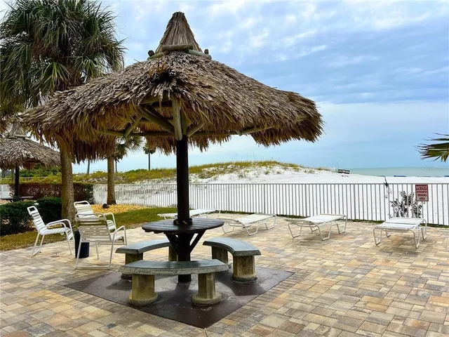 an outdoor space with swimming pool and furniture