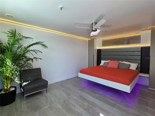 a view of a livingroom with furniture and staircase