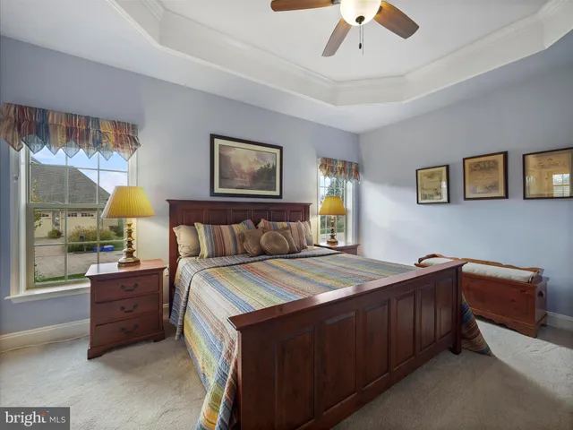 a bed room with a bed and a night stand