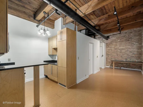 a view of an empty room with a fireplace