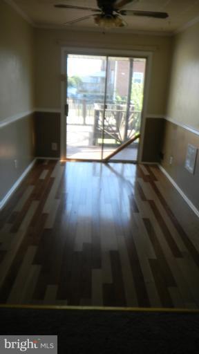 419 Oakwood Road Baltimore, MD 21222 - Photo 14 of 16 a view of an empty room with wooden floor