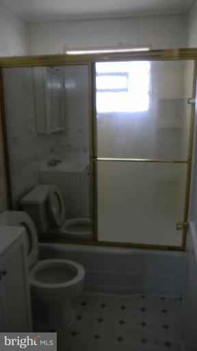 419 Oakwood Road Baltimore, MD 21222 - Photo 7 of 16 a bathroom with a shower